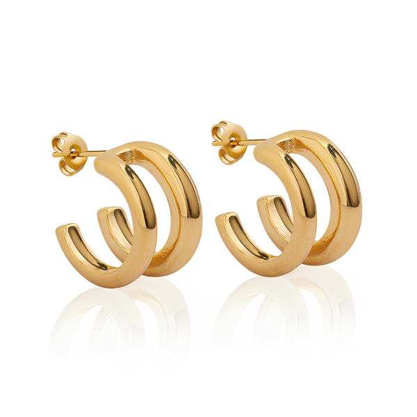 Studio image of EVER’s gold City Strhoop earrings with a bold, layered curve design.et