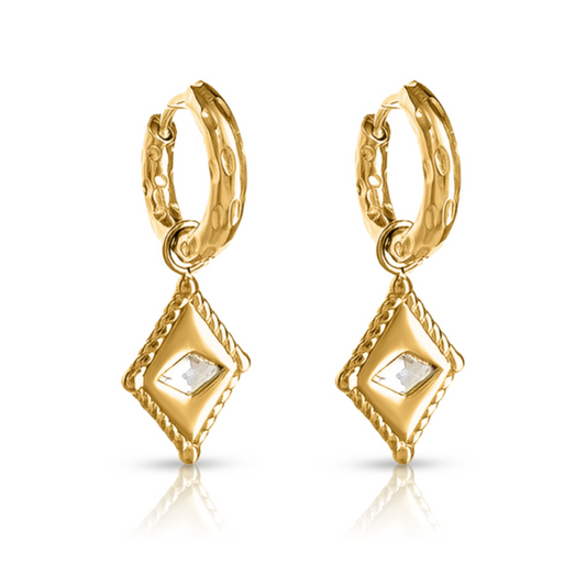 Arena Huggie Earrings – gold huggie earrings with diamond-shaped textured charm on white background