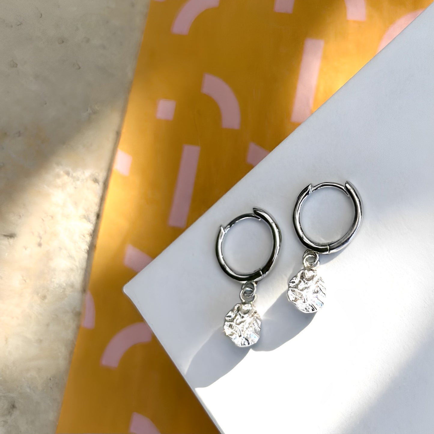 Harmony Silver Huggie Earrings on EVER packaging – sweat-proof and anti-tarnish silver.