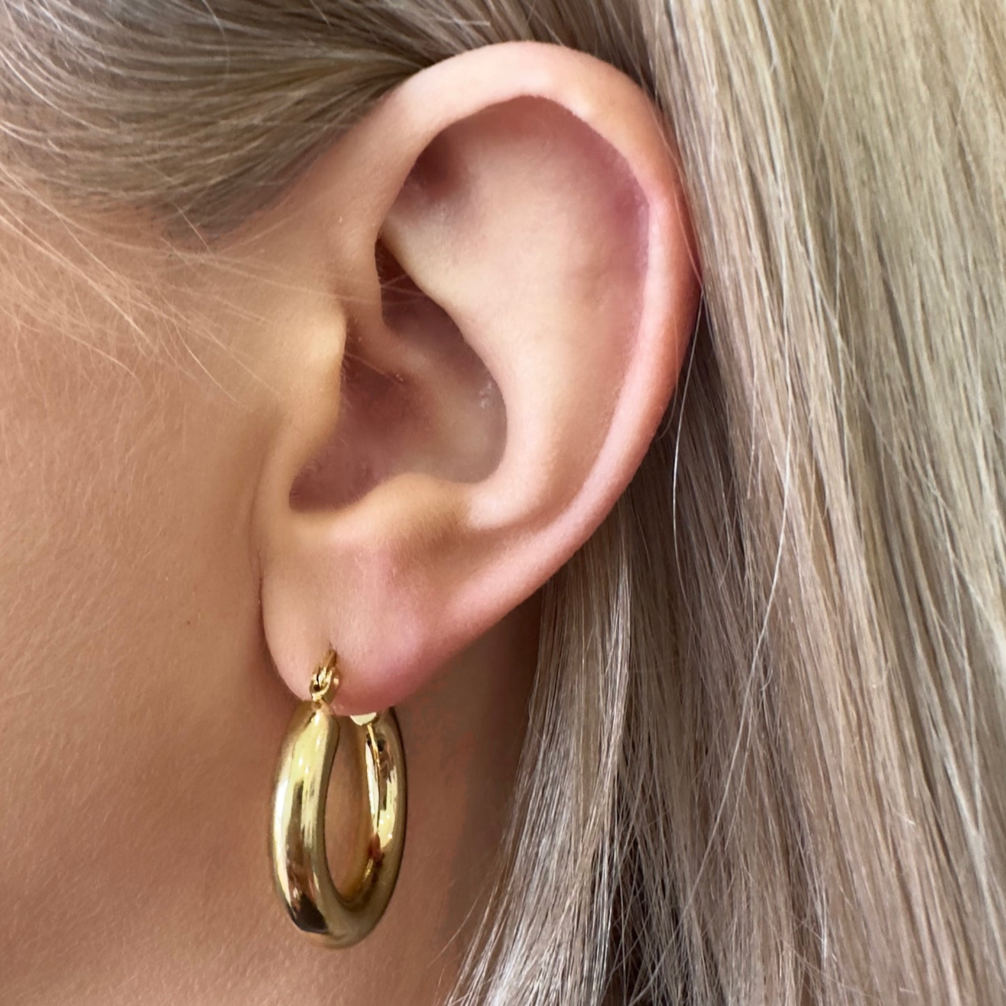close up of Hustle Hoops large on the ear