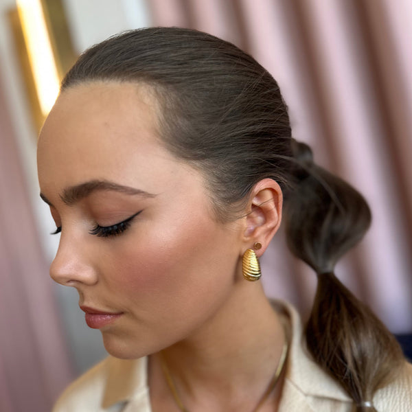 Amplify Gold Drop Earrings styled for night out - waterproof gold statement drop earrings - EVER Jewellery Australia