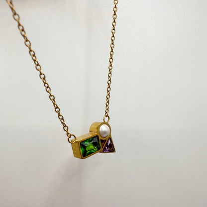 Necklace with geometric pendant on a white background