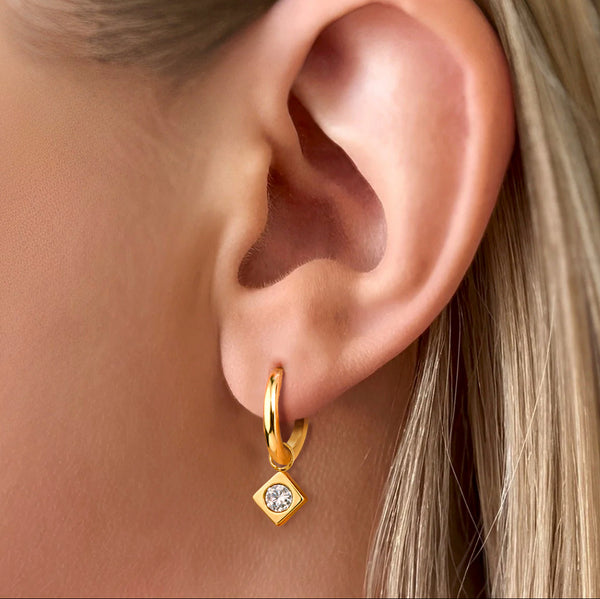 Axis Huggie Earrings on ear - waterproof anti-tarnish gold huggie with gem charm - EVER Jewellery