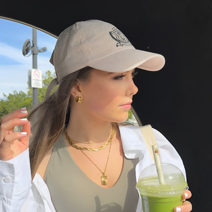 Tempo Hoop Earrings on model in baseball cap and with green smoothie
