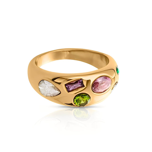 Gold ring with multicolored gemstones on a white background