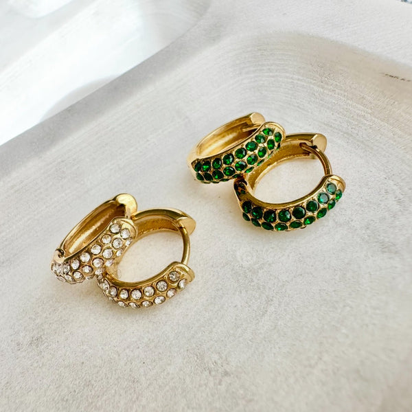 gravitate-emerald-huggie-earrings-flat-lay-gold-silver-ever-jewellery