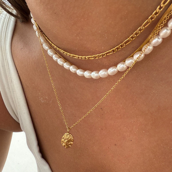 Harmony gold pendant necklace layered with pearl chain on woman — EVER Jewellery Australia