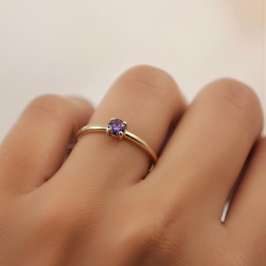 Jaxon Ring Amethyst worn on hand, gold band with amethyst stone