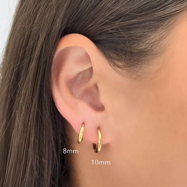Metro Gold Huggie Earrings on ear  showing sizes - waterproof anti-tarnish gold huggie earrings - EVER Jewellery