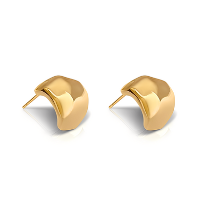 Gold earrings on a white background