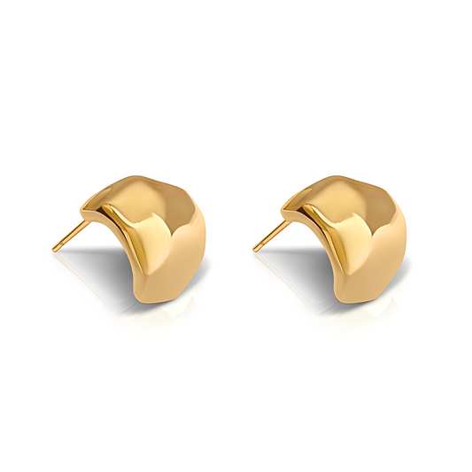 Gold earrings on a white background