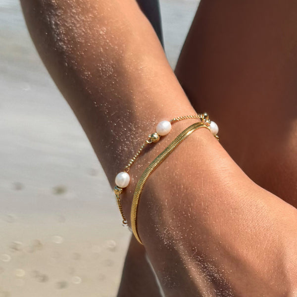 Off Court Pearl Bracelet worn at beach - waterproof pearl and gold chain bracelet - EVER Jewellery Australia