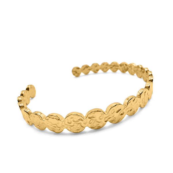 Gold bracelet with textured design on a white background