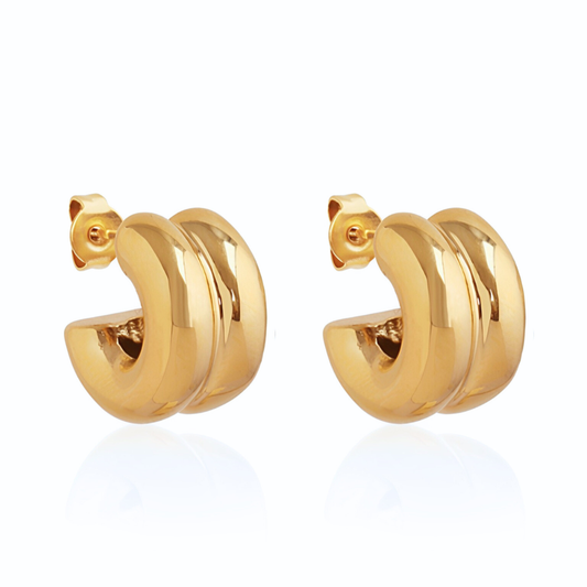 Pair of gold hoop earrings on a white background