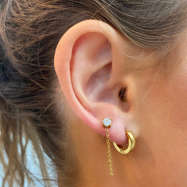 Trackside Gold Huggie Earrings on ear - waterproof anti-tarnish minimalist gold huggies - EVER Jewellery