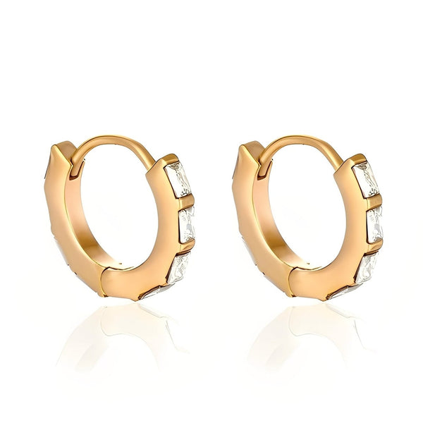 Gold hoop earrings with embedded stones on a white background