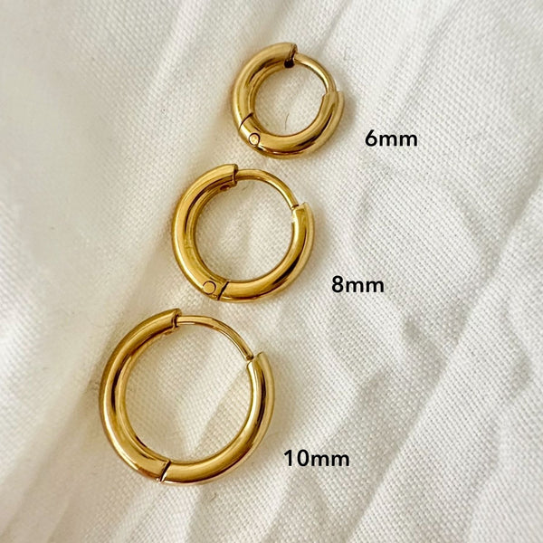 Metro Gold Huggie Earrings flat lay showing sizes - waterproof anti-tarnish gold huggie earrings Australia - EVER Jewellery