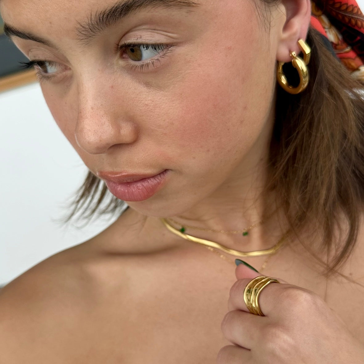 Close-up of model with Double Play Ring – chic gold ring styling shot