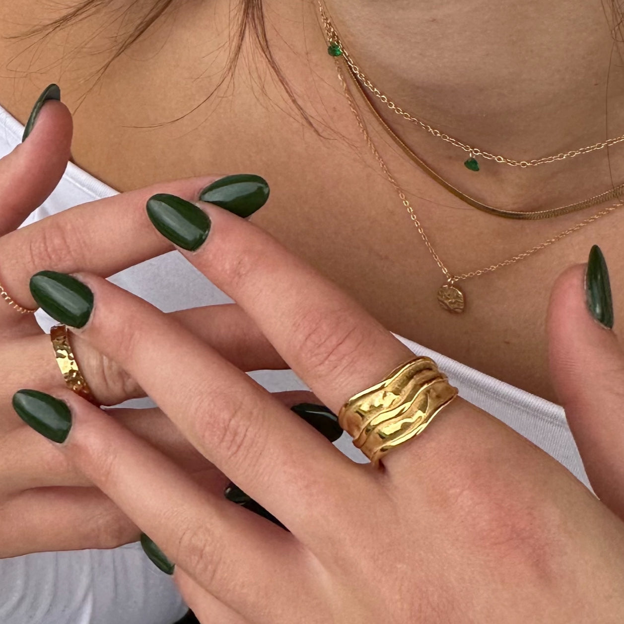 Double Play Ring stacked on fingers with green nails – bold everyday styling