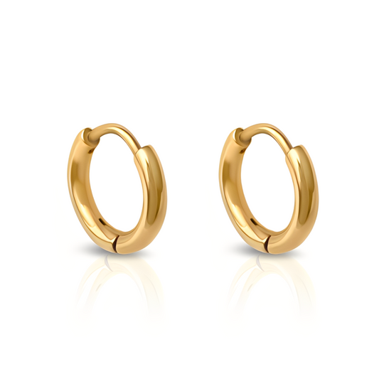 Gold hoop earrings on a white background