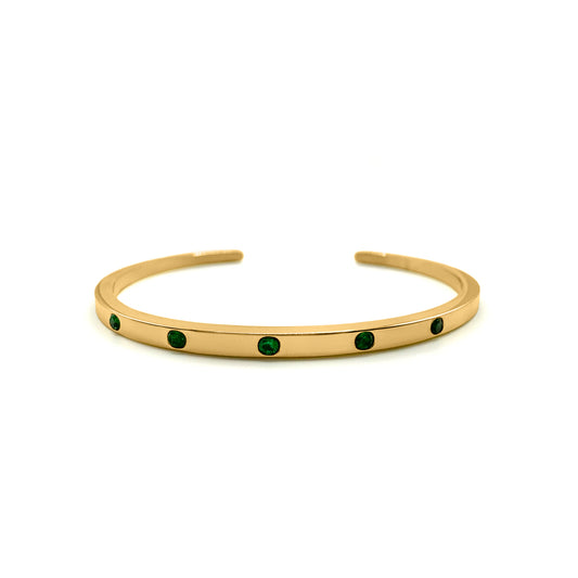 EVER Playmaker Cuff Bracelet in gold-plated stainless steel featuring six round emerald-green stones, displayed on a white background.