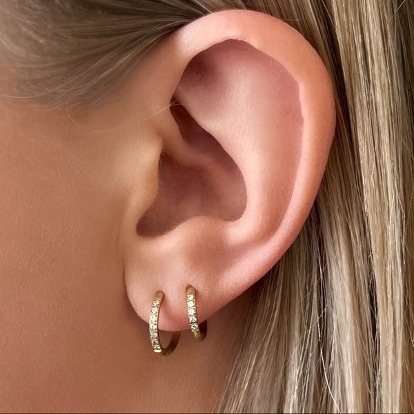 Transition Sleeper Gold Earrings worn in double ear piercings – 8mm and 10mm hoop combo for layered look