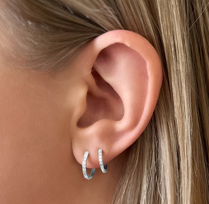 Transition Sleeper Silver Earrings worn in two piercings – mix of 8mm and 10mm hoops stacked on ear