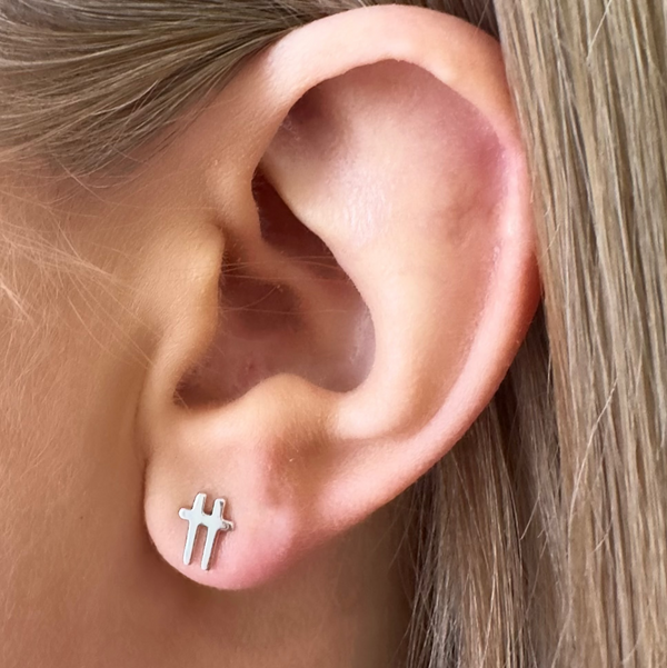 swish-silver-stud-earrings-worn-on-ear-close-up-ever-jewellery